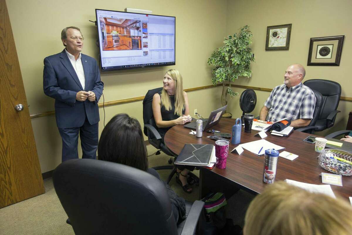 Regan Greer, left, San Antonio division president for JB Goodwin Realtor, says hello to new realtors during a training session at the company's northside offices. JB Goodwin won the 2017 Top Workplaces category for medium-sized employers in San Antonio.