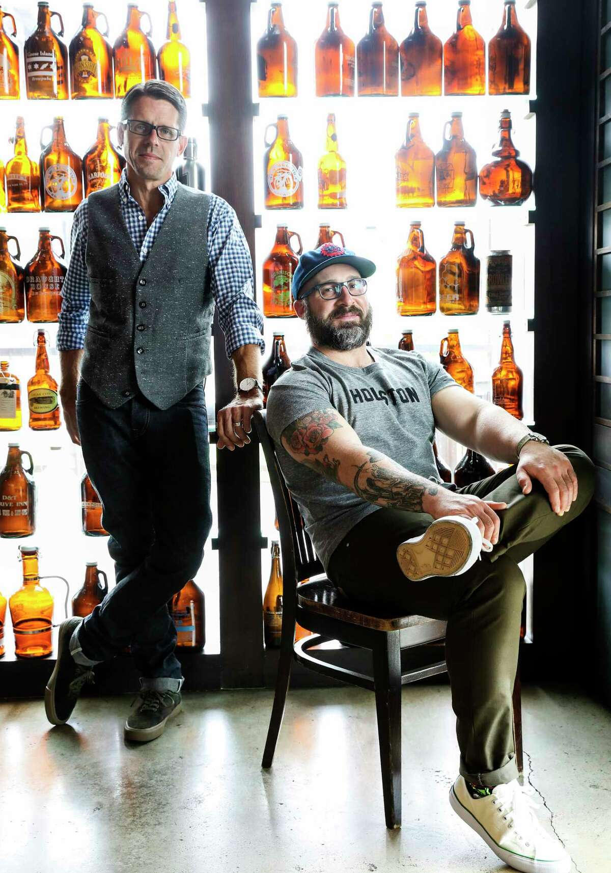 Matthew Pridgen, left, Hay Merchant and Underbelly wine director, and Seth Siegel-Gardner of The Pass & Provisions model mens casual outfits from STAG Provisions for Men at the Hay Merchant restaurant in anticipation of Chris Shepherd's Southern Smoke (Elizabeth Conley / Houston Chronicle )
