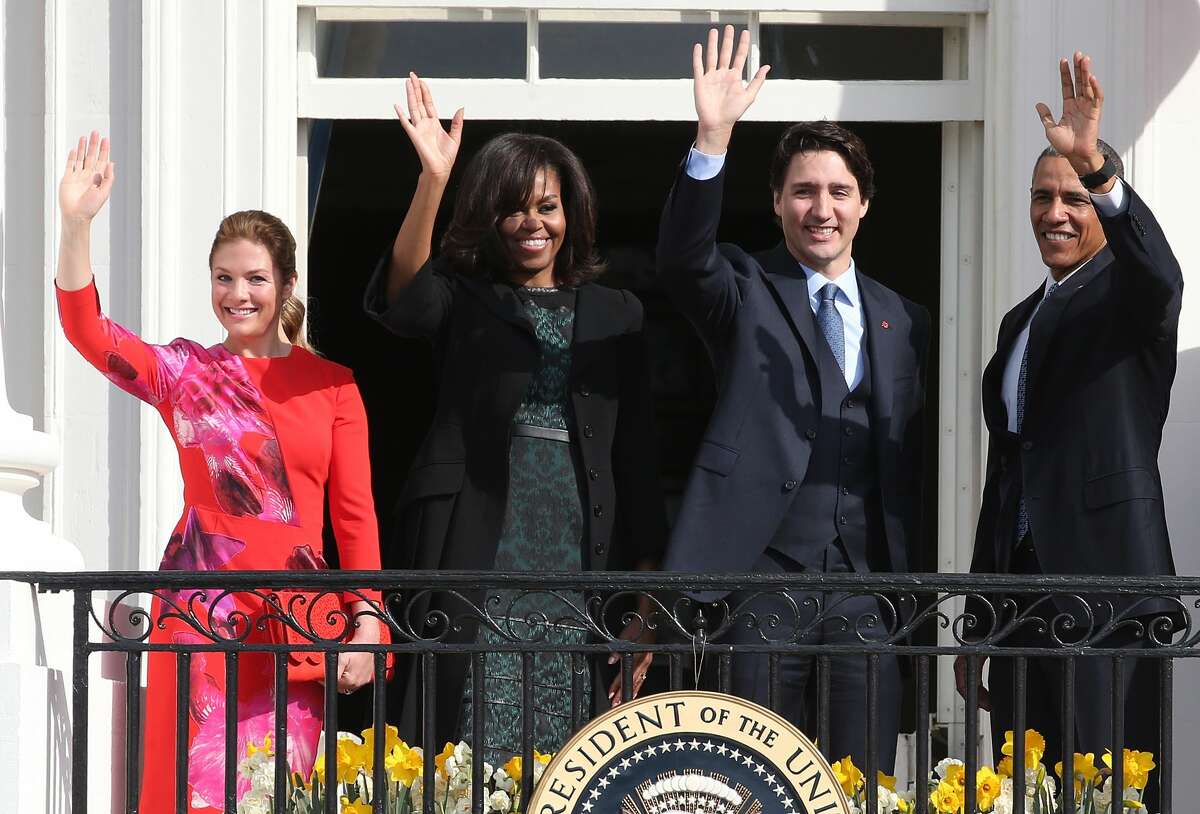 U.S. President Barack Obama (R) and Canadian Prime Minister Justin Trudeau (2nd R), U.S. first lady Michelle Obama (2nd L) and Sophie GrÃ©goire-Trudeau wave to invited guests from the Truman Balcony of the White House after an arrival ceremony at the White House, March 10, 2016 in Washington, DC. This is Trudeau's first trip to Washington since becoming Prime Minister. (Photo by Mark Wilson/Getty Images)