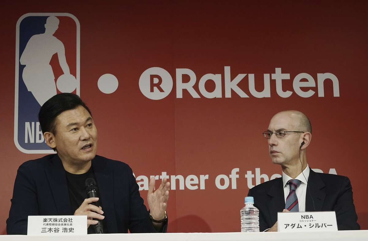 Adam Silver, right, the commissioner of the National Basketball Association (NBA) and Hiroshi Mikitani, left, chairman and CEO of Rakuten, Inc. answers questions during the joint press conference in Tokyo Tuesday, Oct. 10, 2017. Japanese online retailer Rakuten will be NBA's exclusive distribution partner in Japan for live NBA games and a global marketing partner of the NBA. (AP Photo/Eugene Hoshiko)