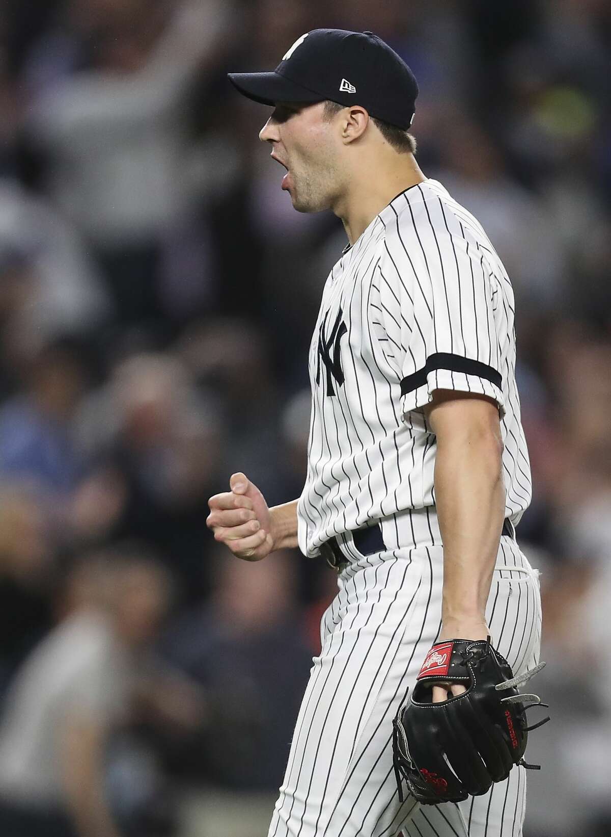 New York Yankees relief pitcher Tommy Kahnle celebrates closing out the Houston Astros during the ninth inning for a 5-0 win in Game 5 of the ALCS at Yankee Stadium on Wednesday, Oct. 18, 2017, in New York. ( Michael Ciaglo / Houston Chronicle )