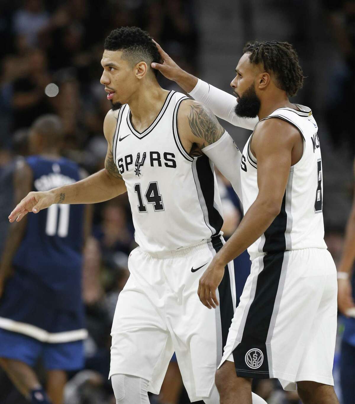 Spurs' Patty Mills (08) congratulates teammate Danny Green (14) after Green hit a three-pointer in the fourth against the Minnesota Timberwolves at the AT&T Center on Wednesday, Oct. 18, 2017. Spurs defeated the T'Wolves, 107-99. (Kin Man Hui/San Antonio Express-News)