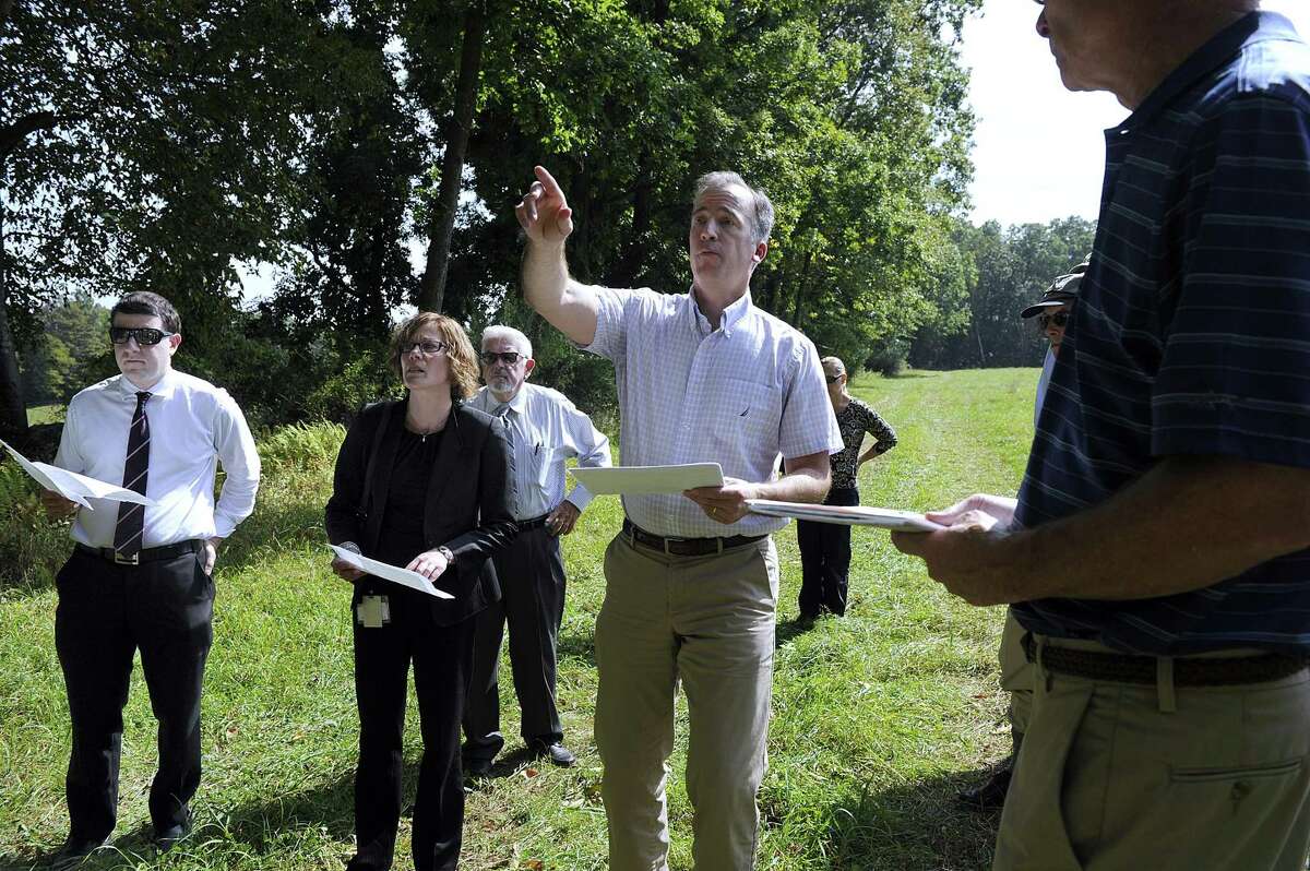 Joel Lindsay, with Ameresco Candlewood Solar LLC, leads a walking tour for the state Siting Council of the area where there is a proposal to build solar panels on Candlewood Mountain in New Milford, Tuesday, Sept. 26, 2017.