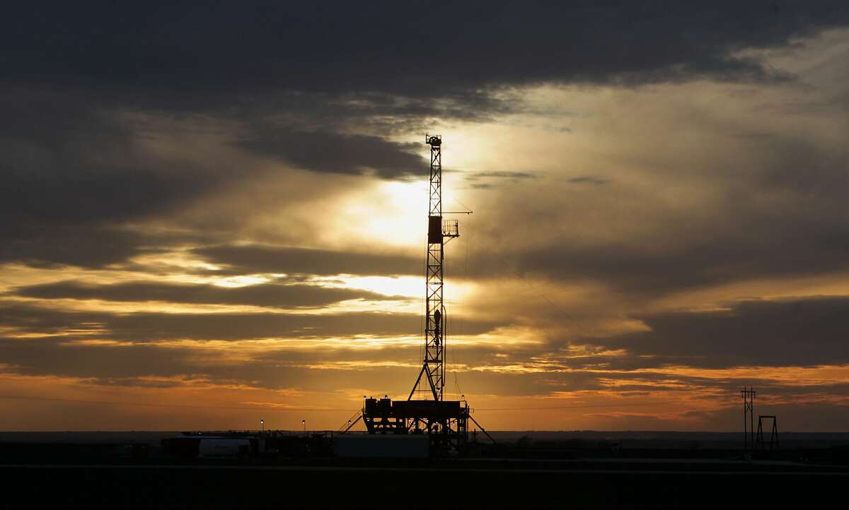 This Feb. 17, 2014 photo shows a drilling rig in Howard county, Texas as the sun sets. The federal Occupational Safety and Health Administration keeps a list of "the worst of the worst" employers in the nation and drilling companies with multiple fatalities should be on it, safety experts say. (AP Photo/Houston Chronicle, James Nielsen)