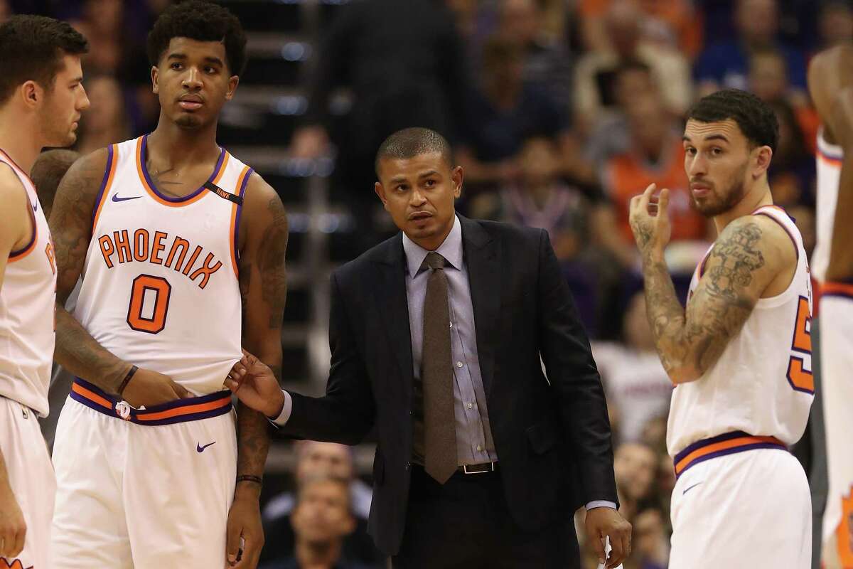 PHOENIX, AZ - OCTOBER 18: Head coach Earl Watson of the Phoenix Suns talks with Marquese Chriss #0 and Mike James #55 during the second half of the NBA game against the Portland Trail Blazers at Talking Stick Resort Arena on October 18, 2017 in Phoenix, Arizona. The Trail Blazers defeated the Suns 124-76. NOTE TO USER: User expressly acknowledges and agrees that, by downloading and or using this photograph, User is consenting to the terms and conditions of the Getty Images License Agreement.