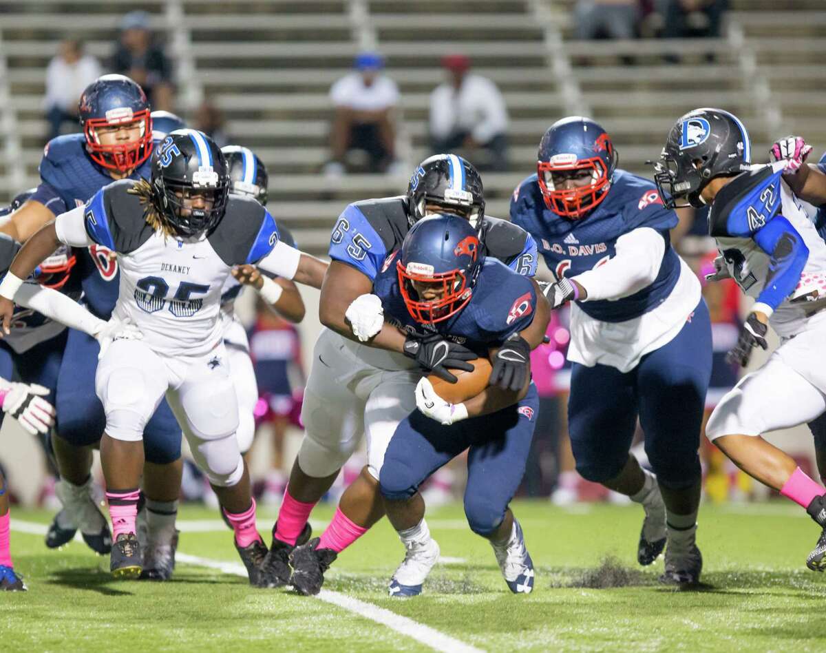 Benjamin O. Davis RB Edward Henry (32) is stopped by the DeKaney defense during the first quarter of a football game between Dekaney vs Aldine Davis high school football game at Thorne Stadium, Thursday, October 19, 2017, in Houston. (Juan DeLeon/for the Houston Chronicle)
