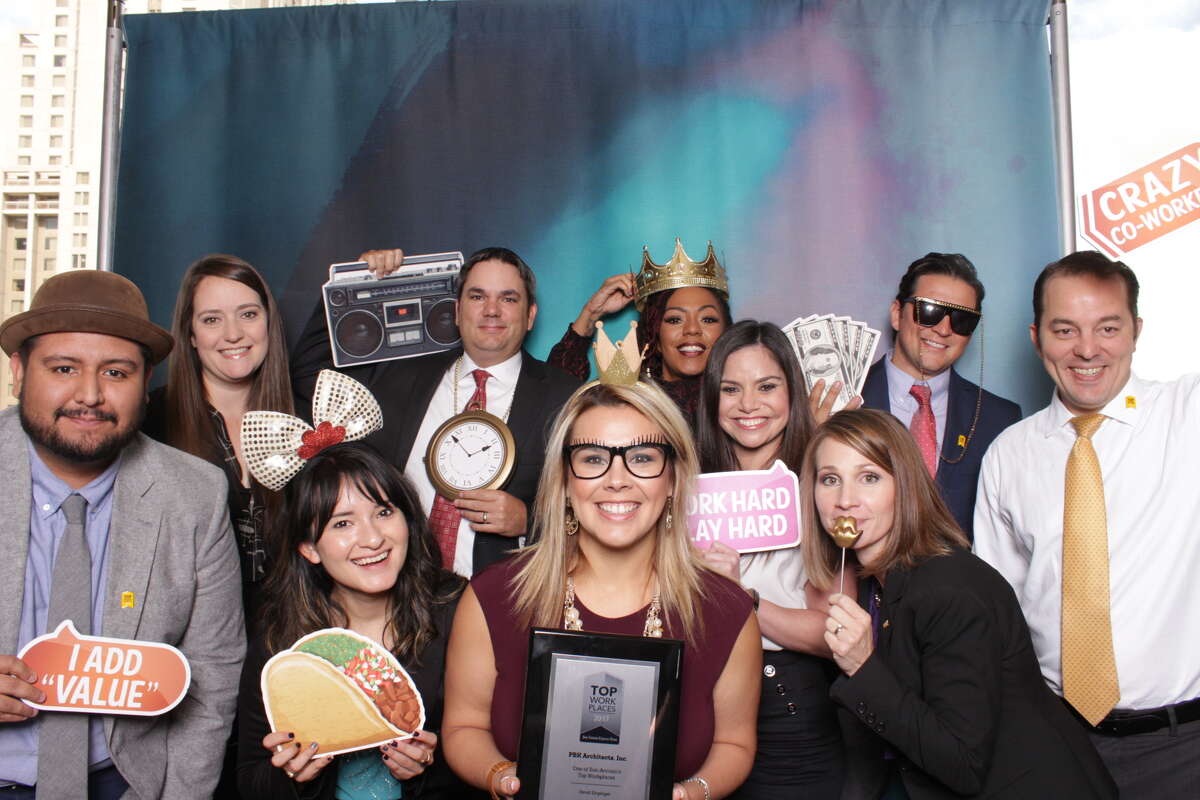 Attendees of the 2017 Top Workplaces luncheon pose for the camera at the event's photo booth. The luncheon, hosted at the Grand Hyatt on Oct. 19, honored the businesses in San Antonio that were voted the best places to work.
