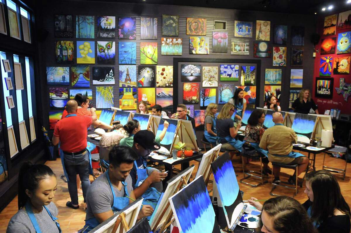 Students paint during class at Pinot's Palette on Taft St. Friday Oct. 13, 2017.(Dave Rossman Photo)