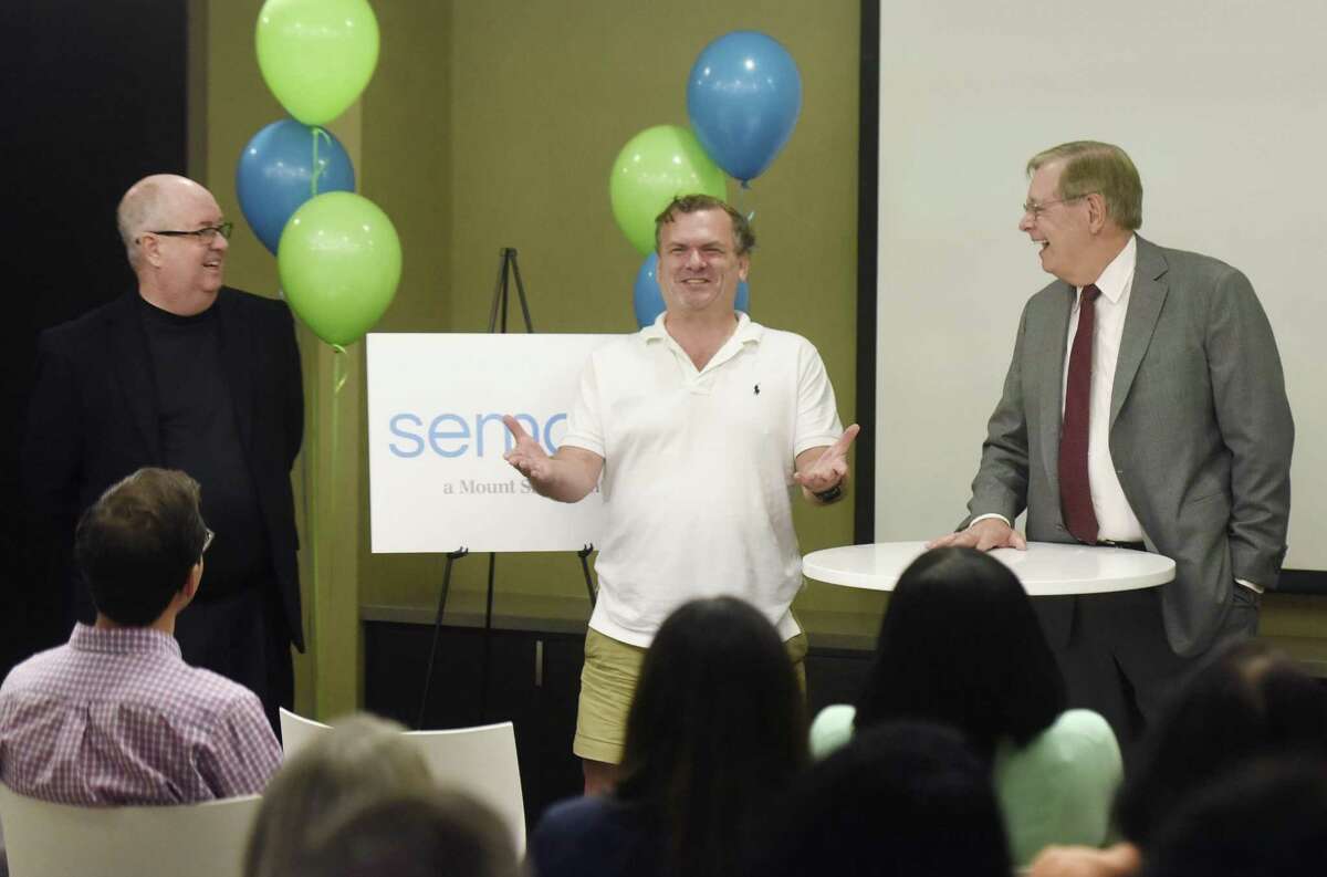 Sema4 President and COO Jamie Coffin, Ph.D., left and CEO Eric Schadt, Ph.D., center, and Stamford Mayor David Martin speak at the Sema4 headquarters at 333 Ludlow St., in Stamford, Conn., on Wednesday, Oct. 11, 2017.