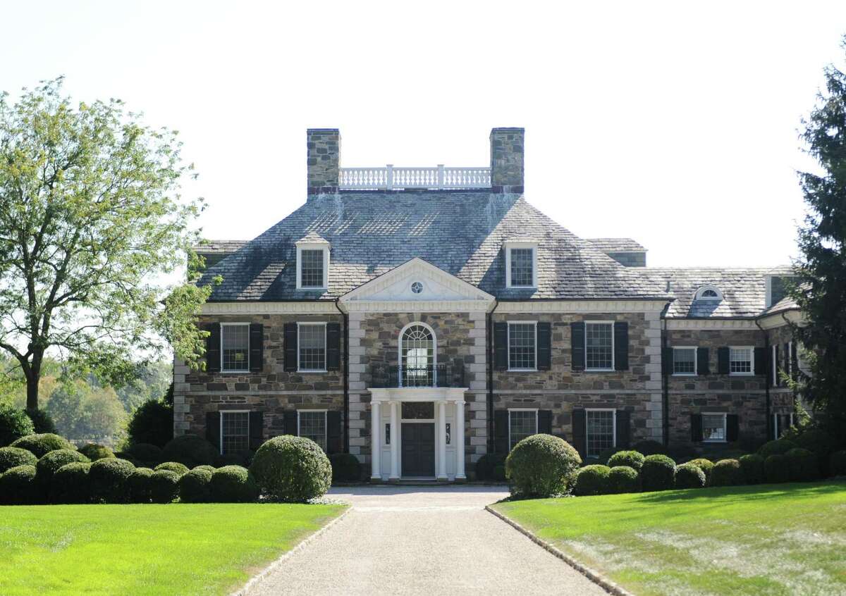 The Georgian colonial mansion on Oneida Drive in Greenwich, Conn., photographed here on Wednesday, Oct. 4, 2017, recently sold for more than $20 million. The 9,780 sq. ft. home sits on nearly four acres in a gated community on Indian Harbor.