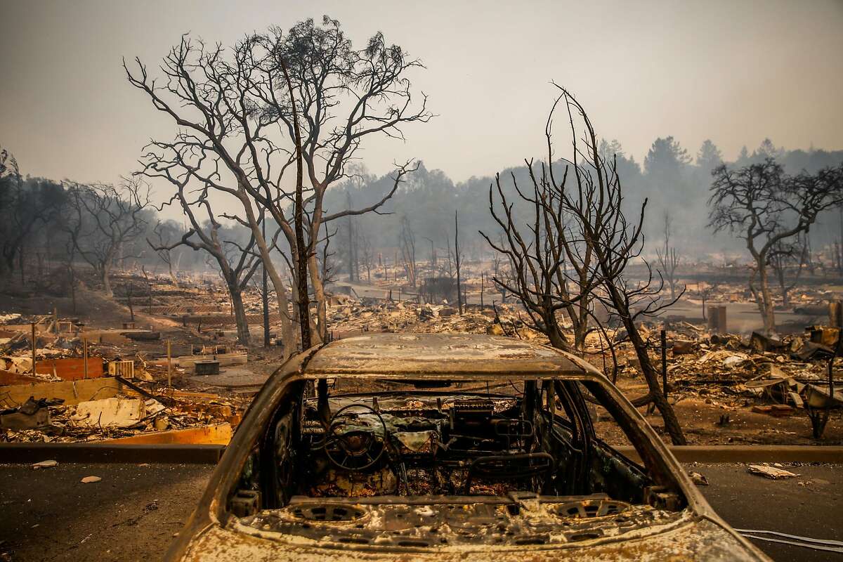 An incinerated car sits in the Fountaingrove neighborhood after being destroyed by the Tubbs fire in Santa Rosa, Calif., on Monday, Oct. 9, 2017.