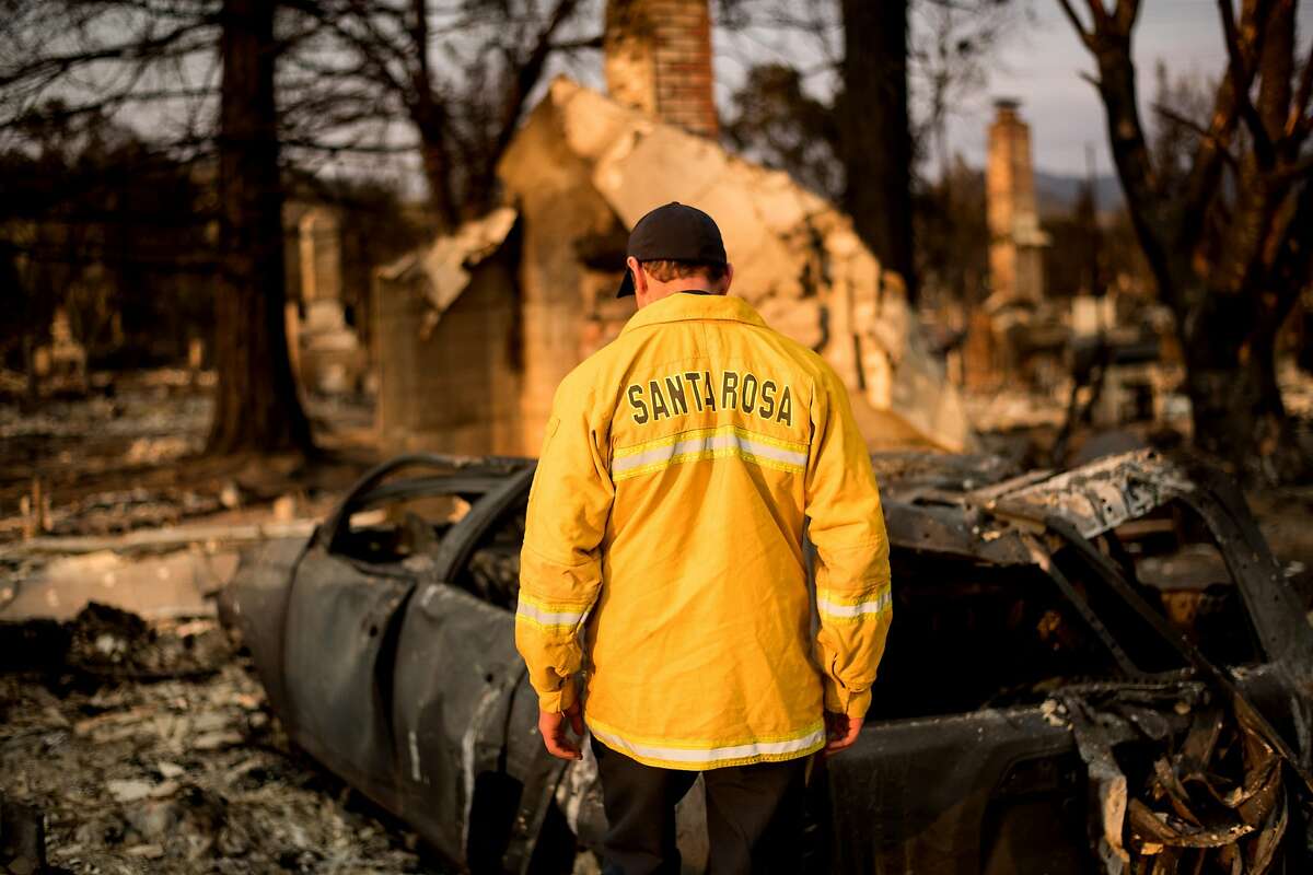 Santa Rosa Assistant Fire Marshall Paul Lowenthal walks through his Oxford Ct. residence, which burned during the Tubbs fire, on Thursday, Oct. 12, 2017, in Santa Rosa.