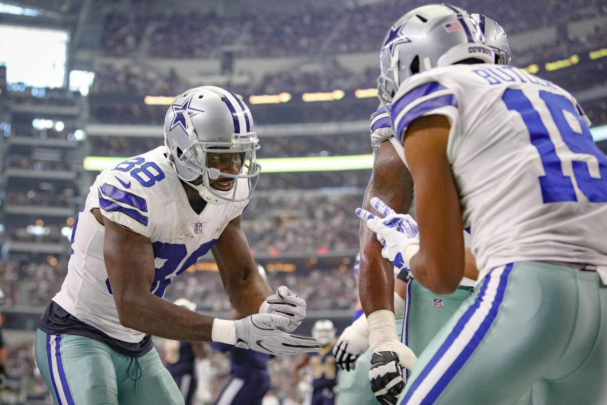 DALLAS COWBOYS After Dallas Cowboys wide receiver Brice Butler (19) makes a touchdown reception, wide receiver Dez Bryant (88) plays Rock, Paper Scissors in celebration during the NFL game between the Los Angeles Rams and Dallas Cowboys on October 1, 2017 at AT&T Stadium in Arlington, TX. 
