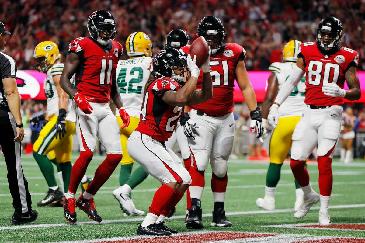 ATLANTA FALCONS Devonta Freeman #24 of the Atlanta Falcons celebrates after scoring a 1-yard rushing touchdown during the first quarter against the Green Bay Packers at Mercedes-Benz Stadium on September 17, 2017 in Atlanta, Georgia.
