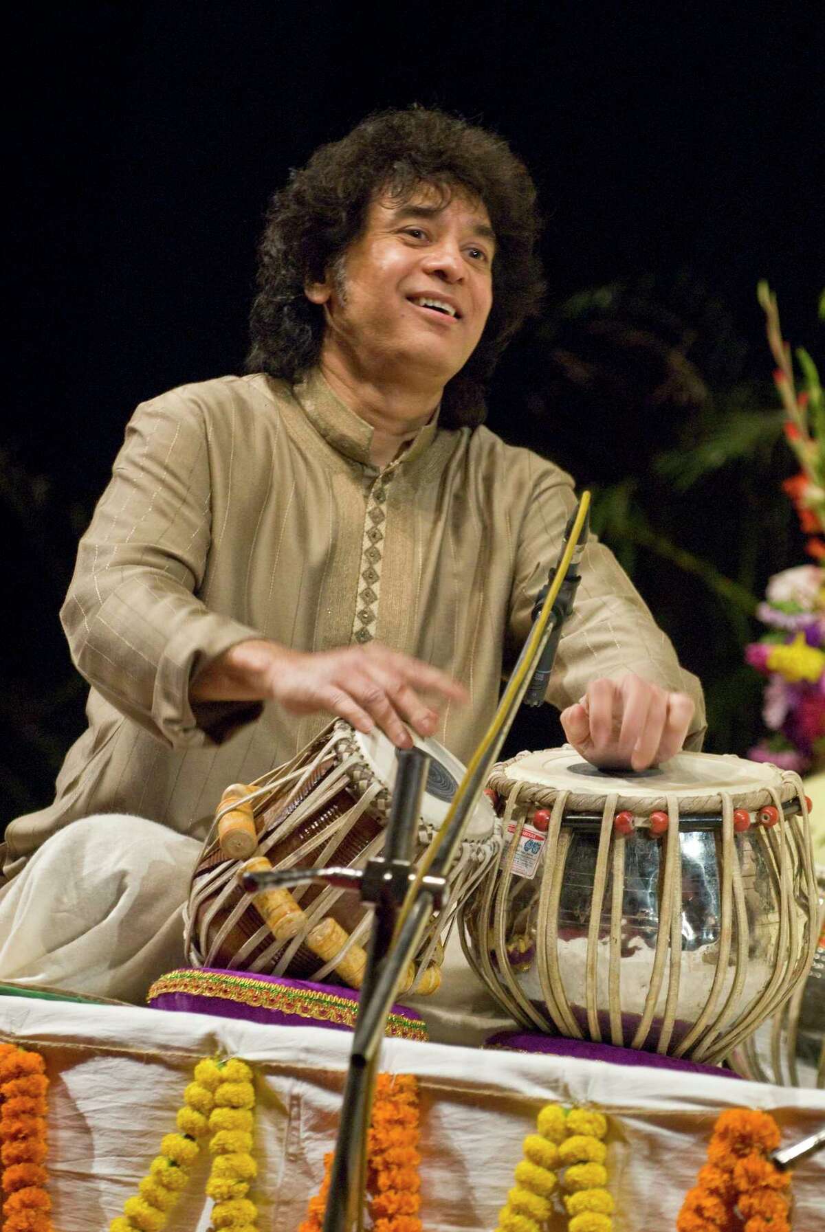 Tabla virtuoso Zakir Hussain leads his Crosscurrents ensemble, featuring prominent jazz and Indian musicians.