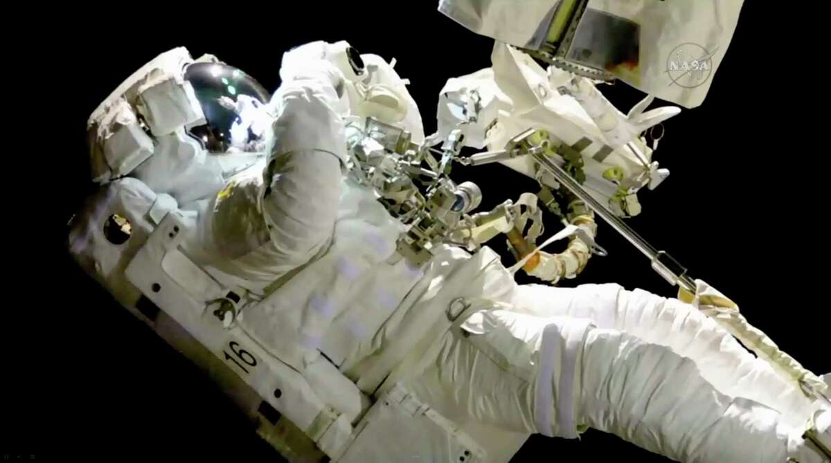Joe Acaba on a spacewalk outside the International Space Station Friday. Acaba was outside an hour when he had to replace one of his safety tethers.