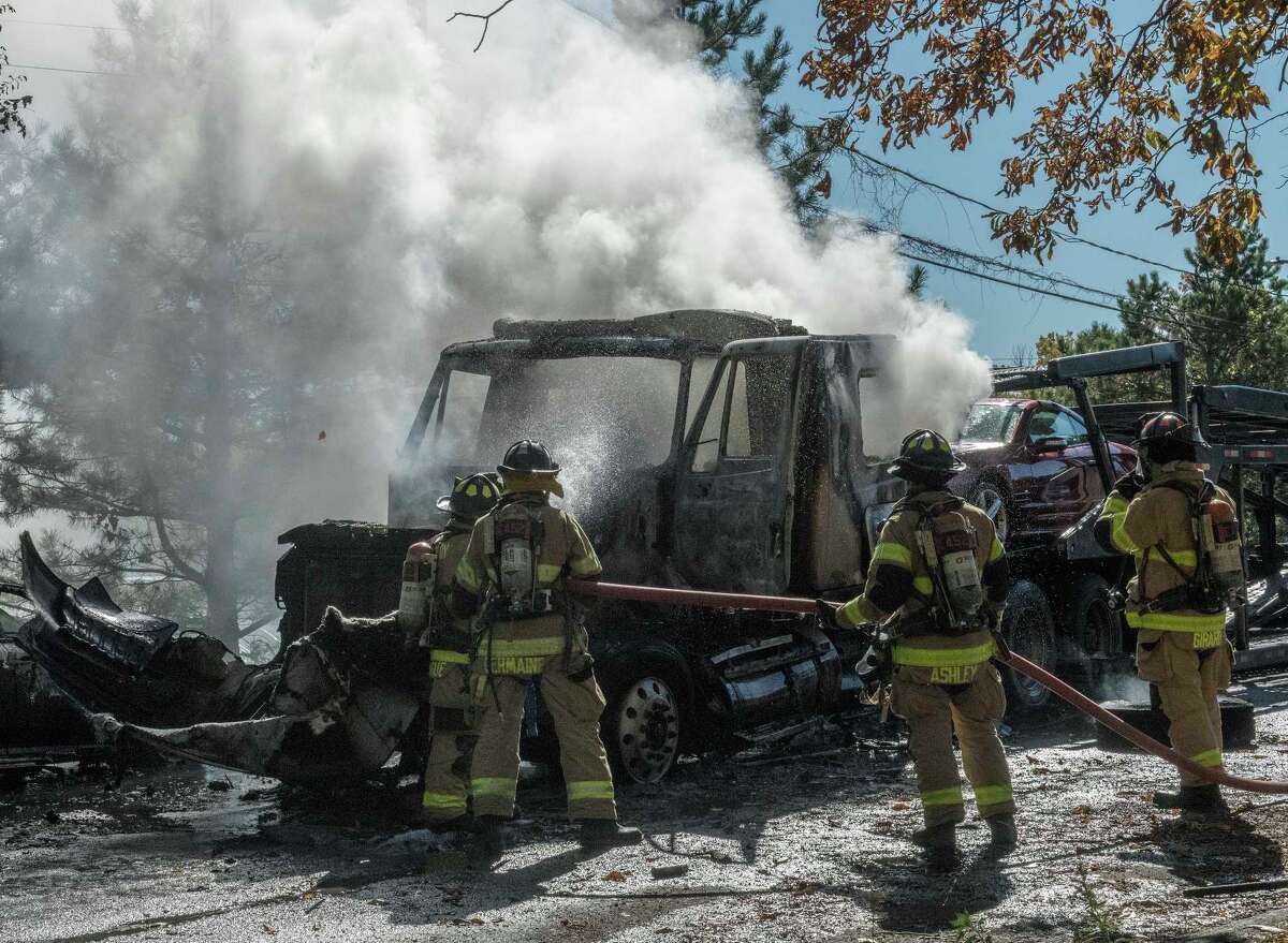 Firefighters attack car carrier blaze