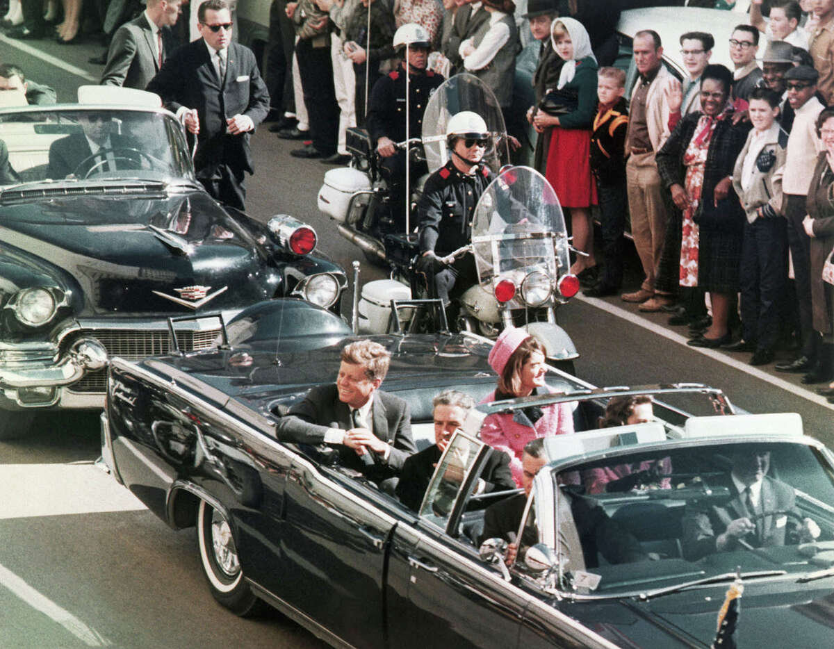 President John F. Kennedy's motorcade travels through Dallas on Nov. 22, 1963. 