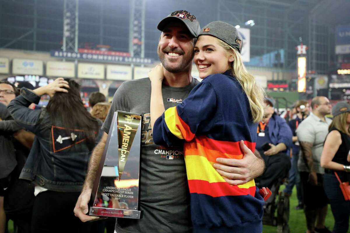 HOUSTON, TX - OCTOBER 21: Justin Verlander #35 of the Houston Astros celebrates with model Kate Upton and the MVP trophy after defeating the New York Yankees by a score of 4-0 to win Game Seven of the American League Championship Series at Minute Maid Park on October 21, 2017 in Houston, Texas. The Houston Astros advance to face the Los Angeles Dodgers in the World Series.