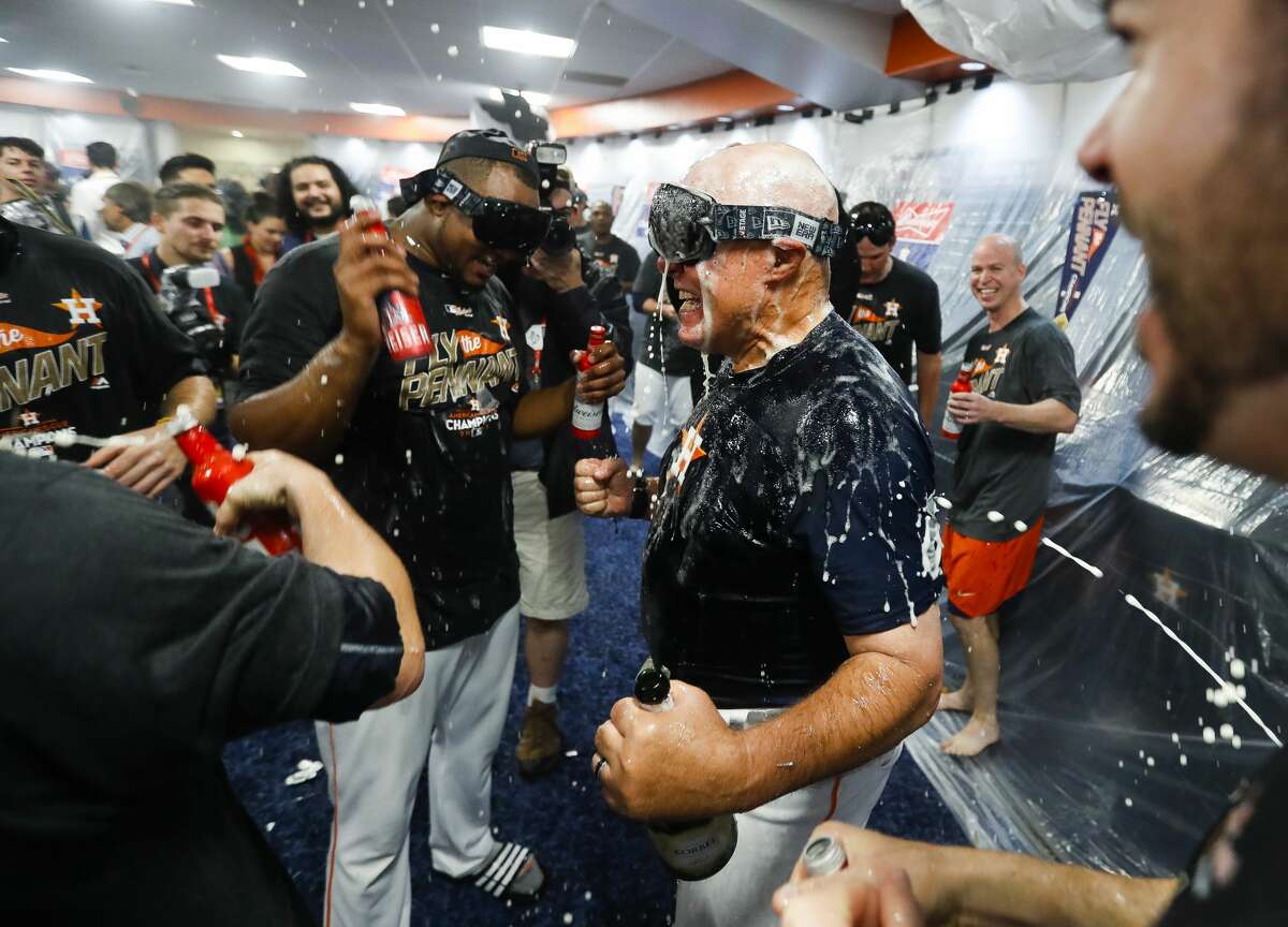 Astros pitching coach Brent Strom celebrates the Astros 4-0 win over the Yankees in Game 7 of the ALCS at Minute Maid Park, Satuday, Oct. 21, 2017, in Houston.