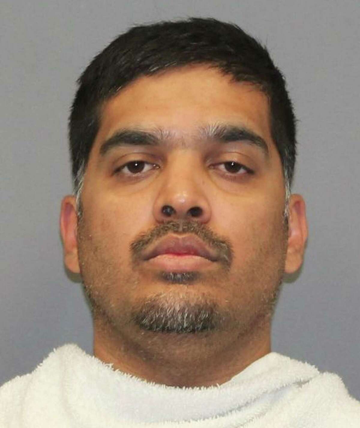 In this Saturday, Oct. 7, 2017 photo provided by the Richardson Texas Police Department, Wesley Mathews is shown. Mathews was arrested Saturday on a charge of abandoning or endangering a child. Authorities were searching Monday for the 3-year-old suburban Dallas girl after she went missing over the weekend when her Mathews allegedly made her stand outside in the middle of the night as punishment for not drinking her milk. (Richardson Texas Police Department via AP)