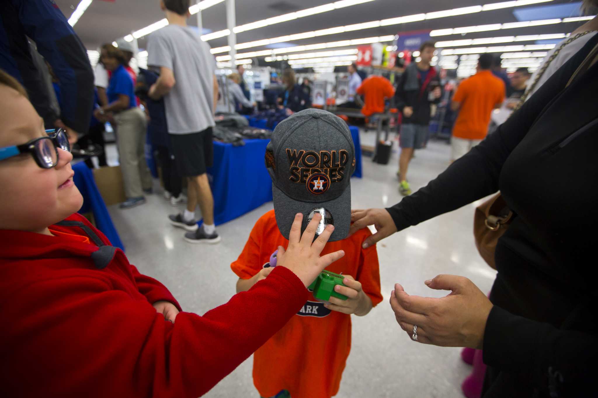 Fans wait in long lines at Academy stores to buy Astros' gear