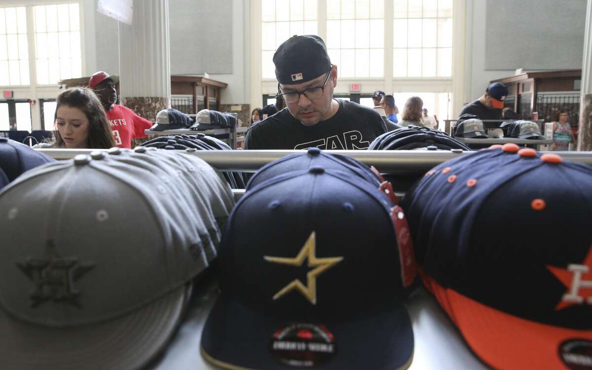 Houston Astros fan Jacob Serrata, who alreay has postseason merchandise, shops for the Astros World Series merchandise at the Minute Maid Park team store on Sunday, Oct. 22, 2017, in Houston. ( Yi-Chin Lee / Houston Chronicle )