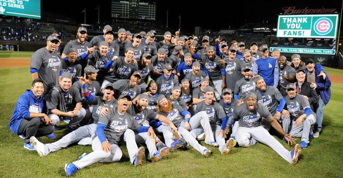 The Los Angeles Dodgers celebrate after an 11-1 series-clinching win against the Chicago Cubs in Game 5 of the National League Championship Series at Wrigley Field in Chicago on Thursday, Oct. 19, 2017. (Wally Skalij/Los Angeles Times/TNS)
