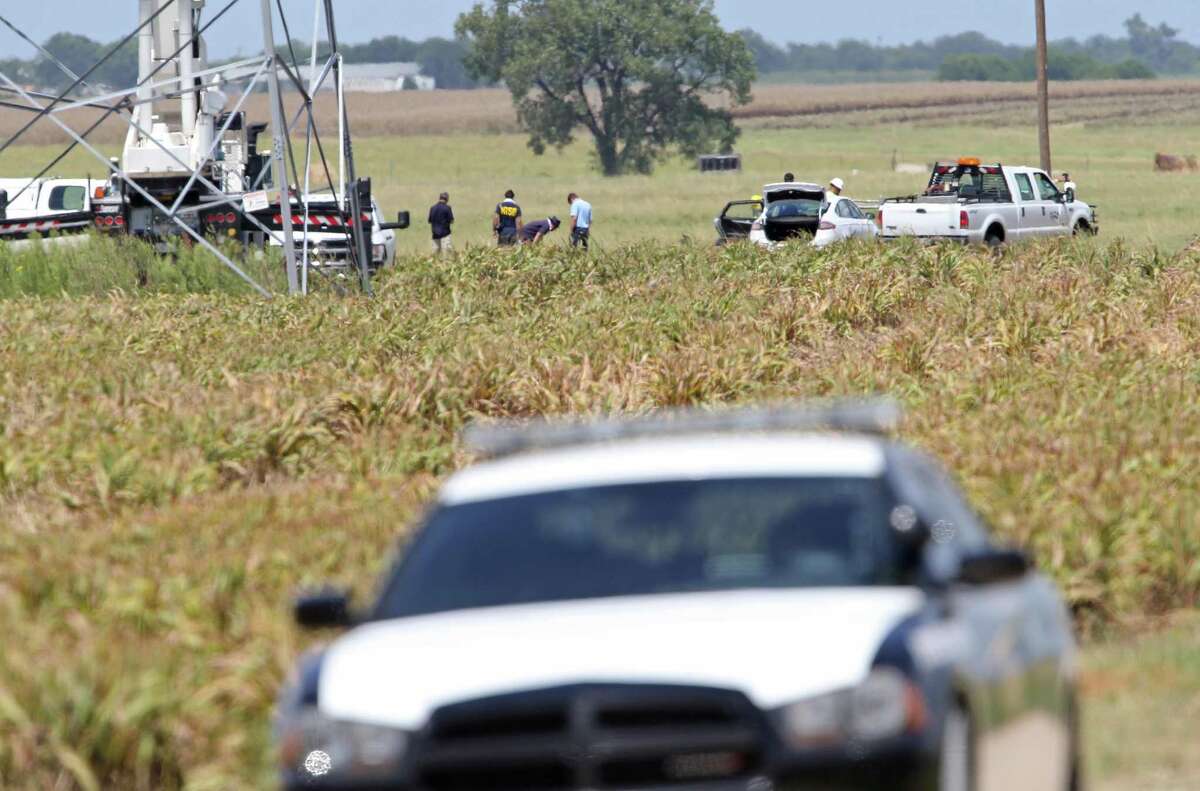 Investigators work the scene of a hot air balloon crash, Sunday July 31, 2016, that killed 16 people near Maxwell, Texas in Caldwell County.