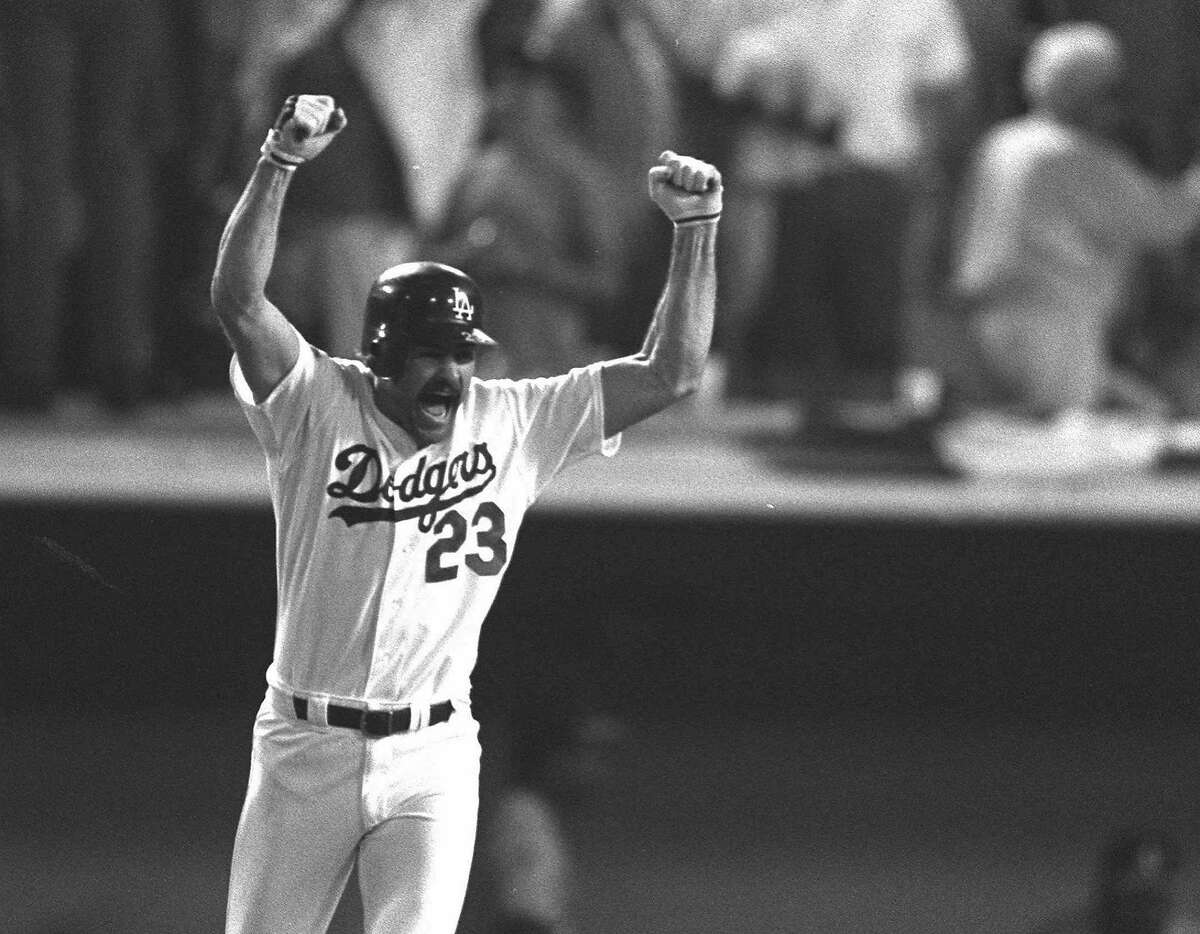 Los Angeles Dodgers Kirk Gibson reacts to his game winning two-run homer in the bottom of the ninth inning Oct. 15, 1988 as he rounds the bases at Dodger Stadium in Los Angeles. The homer gave the Dodgers a 5-4 win over the Oakland A's in the first game of the World Series. (AP Photo/John Swart)