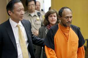 FILE - In this July 7, 2015 file photo, Jose Ines Garcia Zarate, right, is led into the courtroom by San Francisco Public Defender Jeff Adachi for his arraignment at the Hall of Justice in San Francisco.  The murder trial started Monday, Oct. 23, 2017, for Garcia Zarate, a Mexican man who set off a national immigration debate after he shot and killed Kate Steinle on a San Francisco pier on July 1, 2015. Garcia Zarate has said the shooting was accidental. (Michael Macor/San Francisco Chronicle via AP, Pool, File)