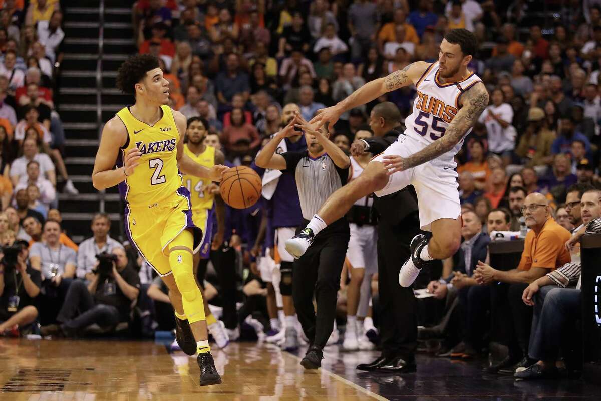 PHOENIX, AZ - OCTOBER 20: Mike James #55 of the Phoenix Suns saves an out of bounds ball against Lonzo Ball #2 of the Los Angeles Lakers during the second half of the NBA game at Talking Stick Resort Arena on October 20, 2017 in Phoenix, Arizona. The Lakers defeated the Suns 132-130. NOTE TO USER: User expressly acknowledges and agrees that, by downloading and or using this photograph, User is consenting to the terms and conditions of the Getty Images License Agreement.