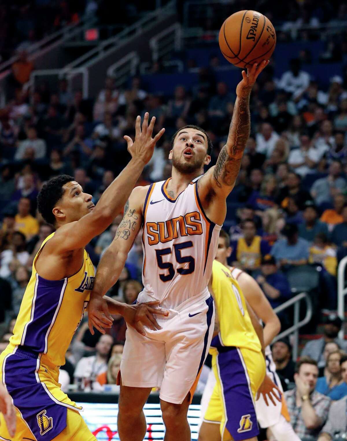 Phoenix Suns guard Mike James (55) shoots over Los Angeles Lakers guard Josh Hart (5) during the second half of an NBA basketball game, Friday, Oct. 20, 2017, in Phoenix. (AP Photo/Matt York)