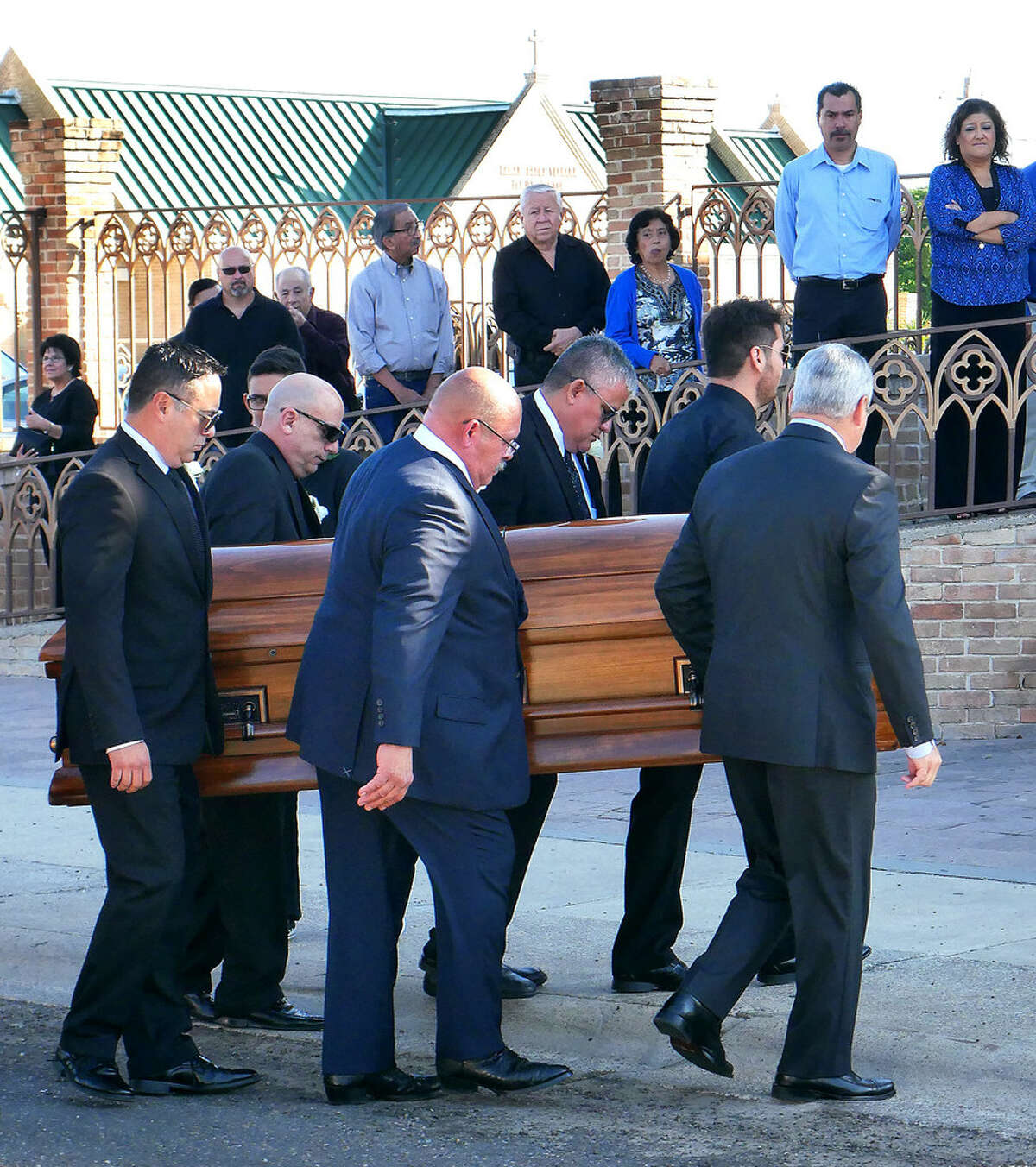 Pallbearers carry the body of former LMT Editor Odilon "Odie" Arambula for funeral services at Holy Redeemer Church, Monday, October 23, 2017.