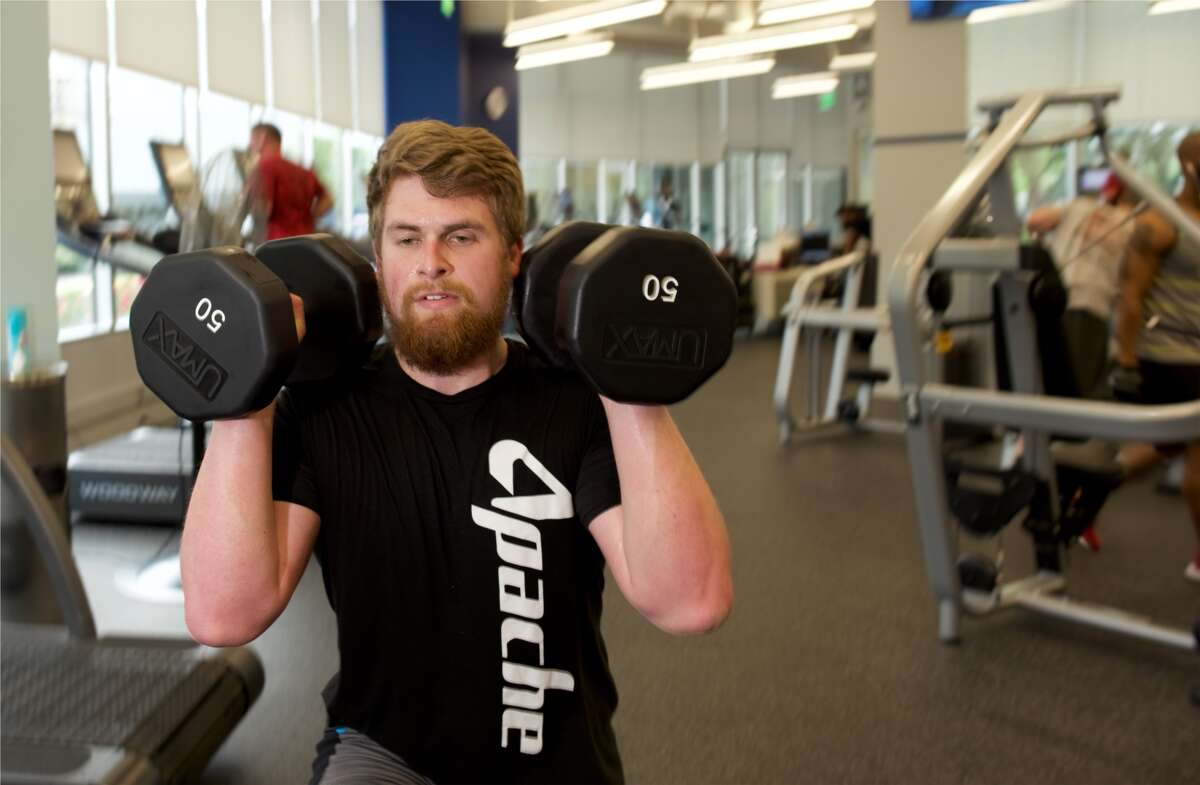 Daniel Matthews, anÂ accountant for Apache Corp.,Â gets in a workout at ApacheFIT.Â Apache Corp. earned a spot on the Chronicle Top Workplaces list for the second year in 2017.