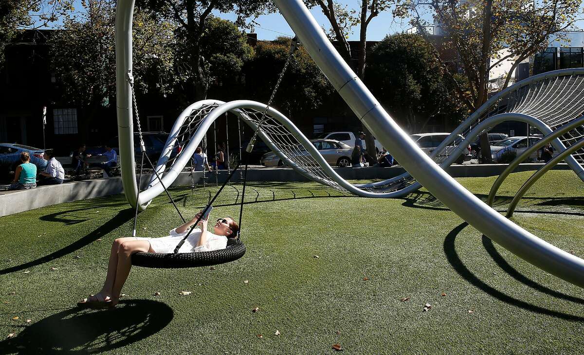 Alexandra Dworsky from San Francisco takes a break during warm weather at South Park on Tuesday October 24, 2017, in San Francisco, Calif.