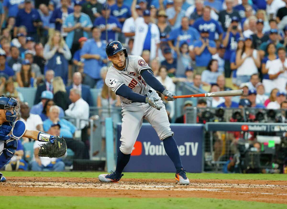 Houston Astros center fielder George Springer (4) strikes out during the third inning of Game 1 of the World Series at Dodger Stadium on Tuesday, Oct. 24, 2017, in Los Angeles.