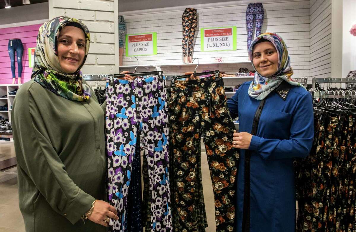 Arzu Demircan, left and Ozgul Ucan show off their products at the new Leggings store at Crossgates Mall Monday Oct. 23, 2017 in Albany, N.Y. (Skip Dickstein/Times Union)