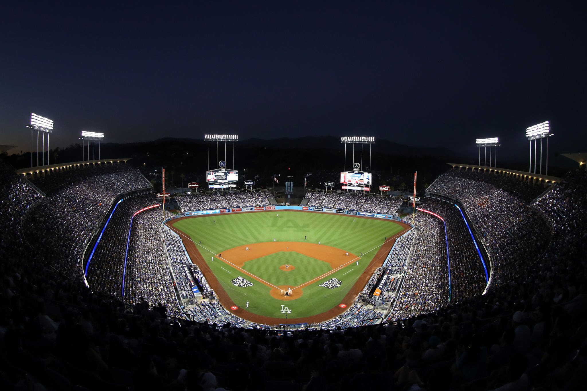 Rob Lowe and Jason Bateman sport fan merchandise at the LA Dodgers