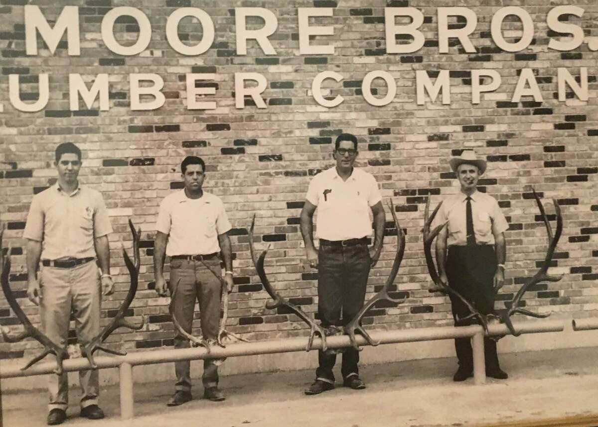 From left, Carter, Tyrone and Howard Moore and Carl Barton Jr. They are pictured in front of Moore Brothers Lumber in Conroe following a hunting trip. Carter Moore and Carl Barton Jr. later became the mayor of Conroe.