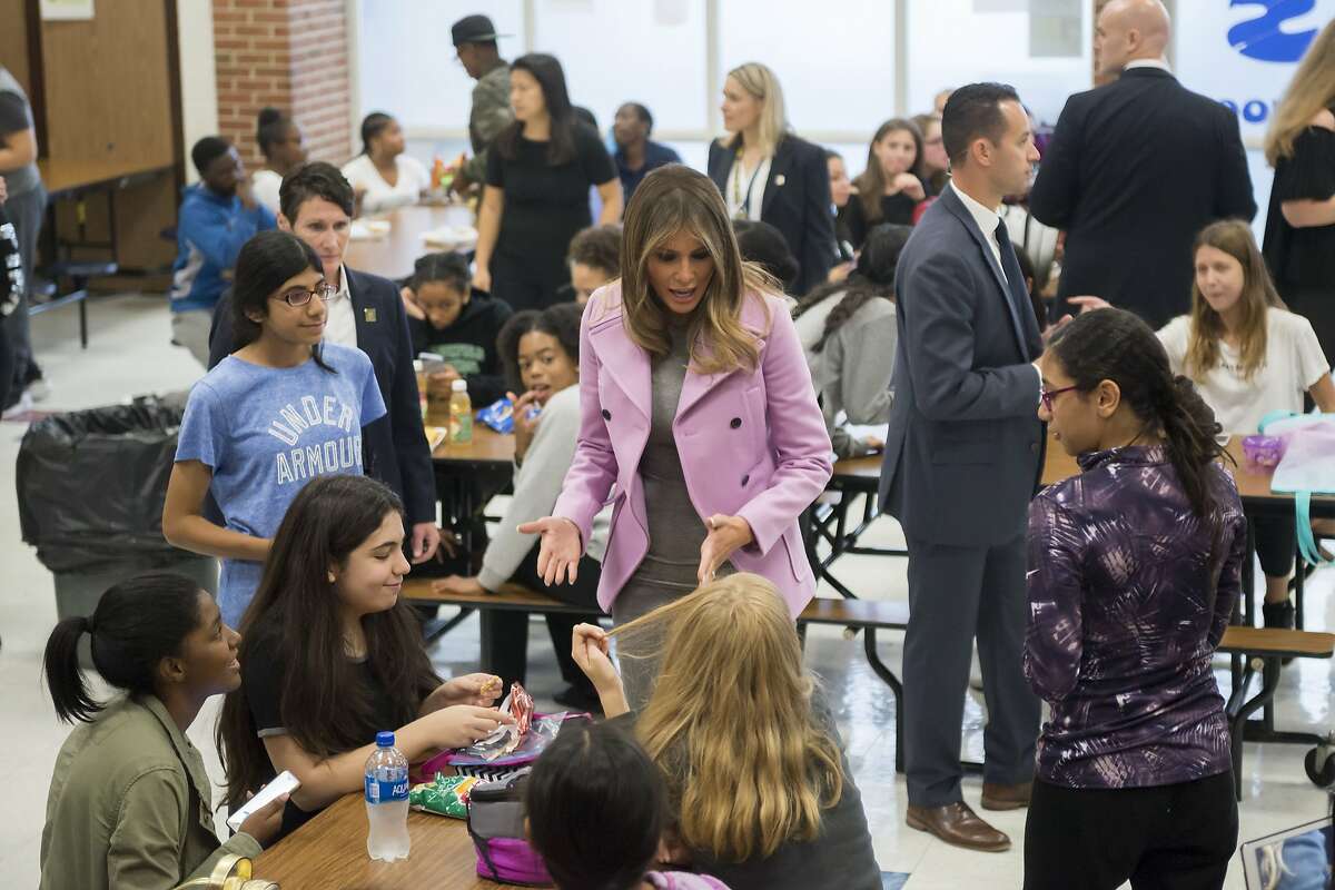 First lady Melania Trump chats with students while visiting Orchard Lake Middle School in West Bloomfield, Mich., Monday, Oct. 23, 2017. (David Guralnick/Detroit News via AP)
