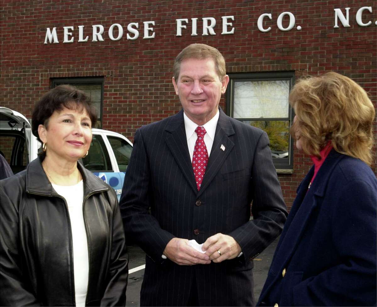 In 2002 at a Melrose polling place, Assemblyman Pat Casale emerges from the polling to see his wife Mary Casale, and his daughter Lisa.