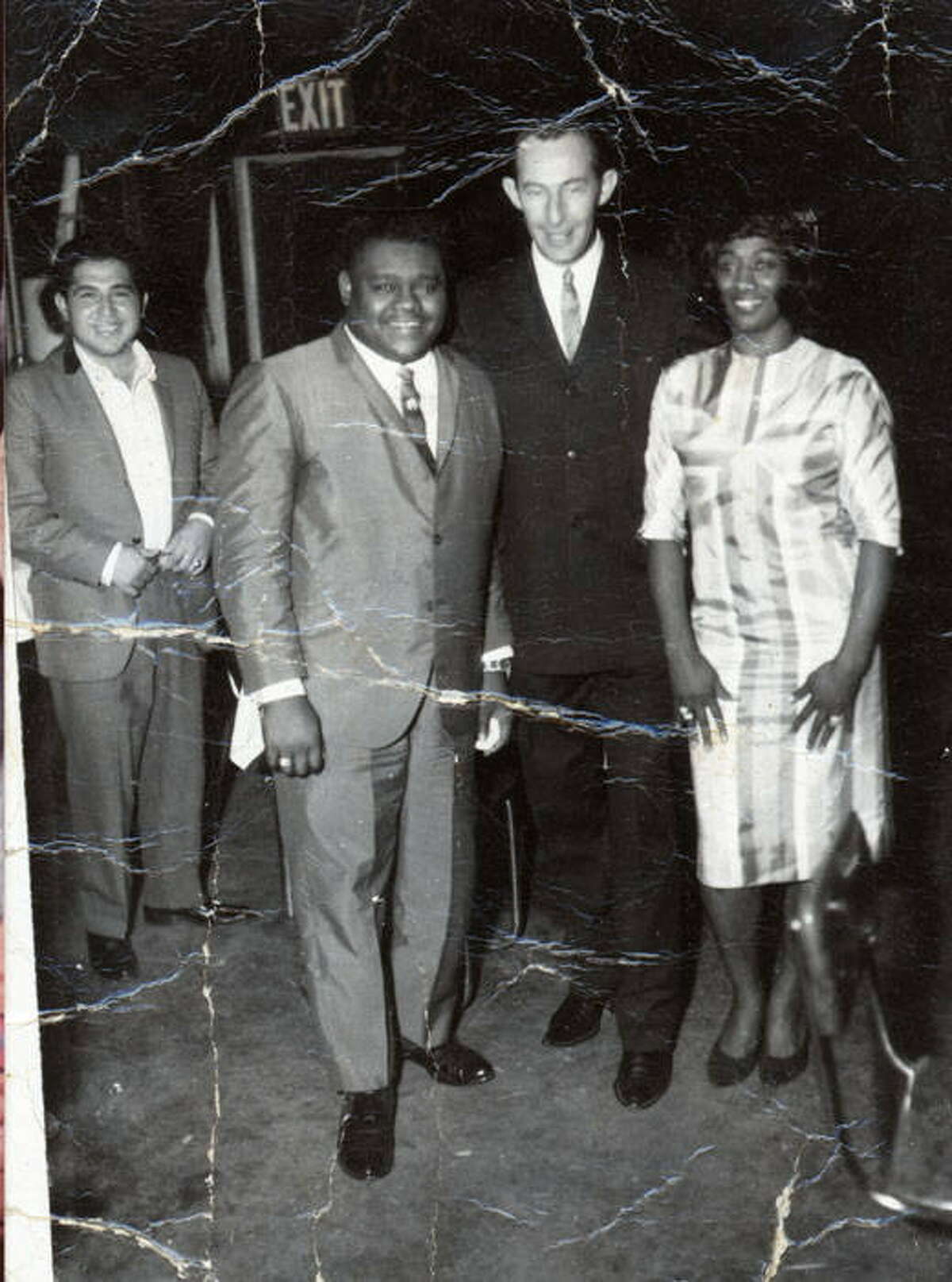 Fats Domino and Velma Patterson 'Miss Wiggles' with a fan at Eastwood Country Club, St. Hedwig Road, San Antonio, Texas, ca. 1963.