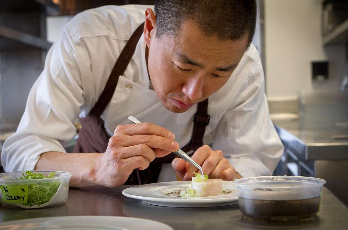 Chef Corey Lee prepares Chicken with Black Moss and Mountain Yam at Benu restaurant in San Francisco on Friday, February 3, 2012.