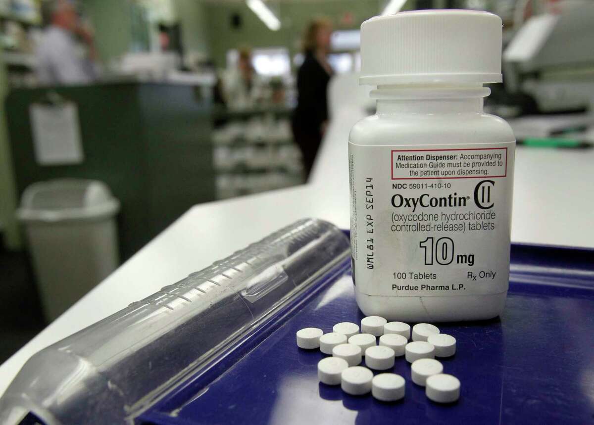 This Tuesday, Feb. 19, 2013 file photo shows OxyContin pills arranged for a photo at a pharmacy in Montpelier, Vt. (AP Photo/Toby Talbot)