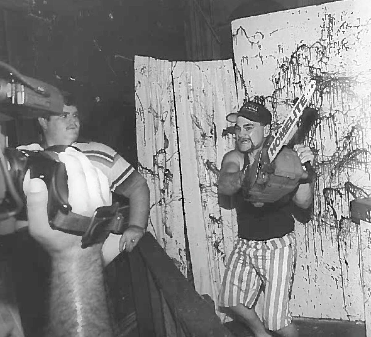 Danny Sciandra tries out for a character in the "Saw Room" at The Haunted Hotel in Beaumont, 1994.  Photo: Enterprise Archives