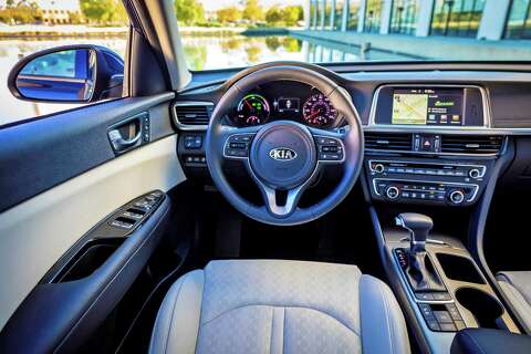 Kia Updates The Optima Hybrid For 2017 Boosts Fuel Economy Standard Kia Optima Ex Hybrid Features Include Leather Seats Dual Zone Automatic Climate Control