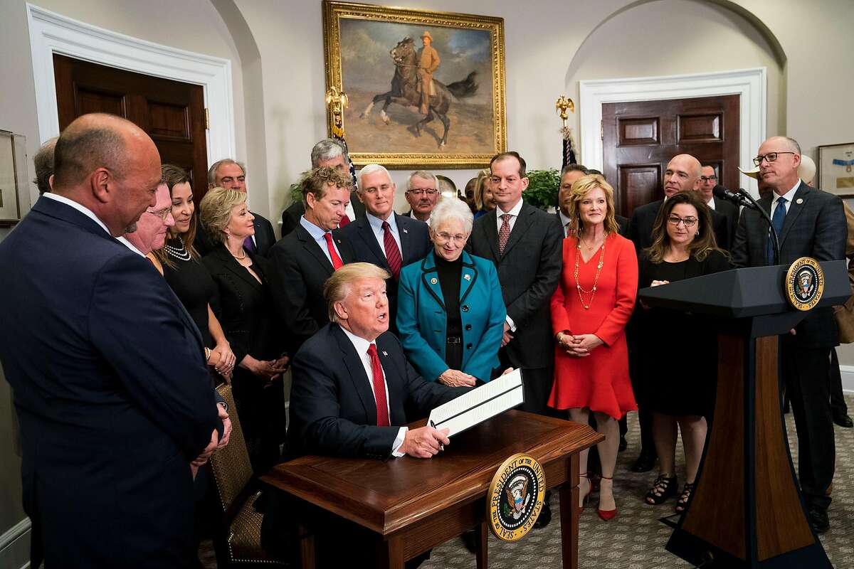 FILE -- President Donald Trump signs an Executive Order on healthcare in the Roosevelt Room of the White House, Oct. 12, 2017. Trump has decided to cut off federal funding to insurance companies for subsidies that help people afford their health care, but state regulators and insurers have found a way to funnel more federal money into the markets and protect consumers from big rate hikes. (Doug Mills/The New York Times)