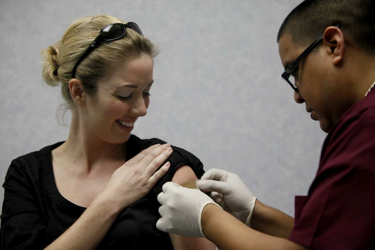 Yes, pregnant women should get flu shots. Here, Christin Gish, who is two and a half months pregnant, gets her H1N1 shot administered by medical assistant Moises Cuellar at the H1N1 Swine Flu Vaccination Clinic at a Texas MedClinic in San Antonio in 2009.