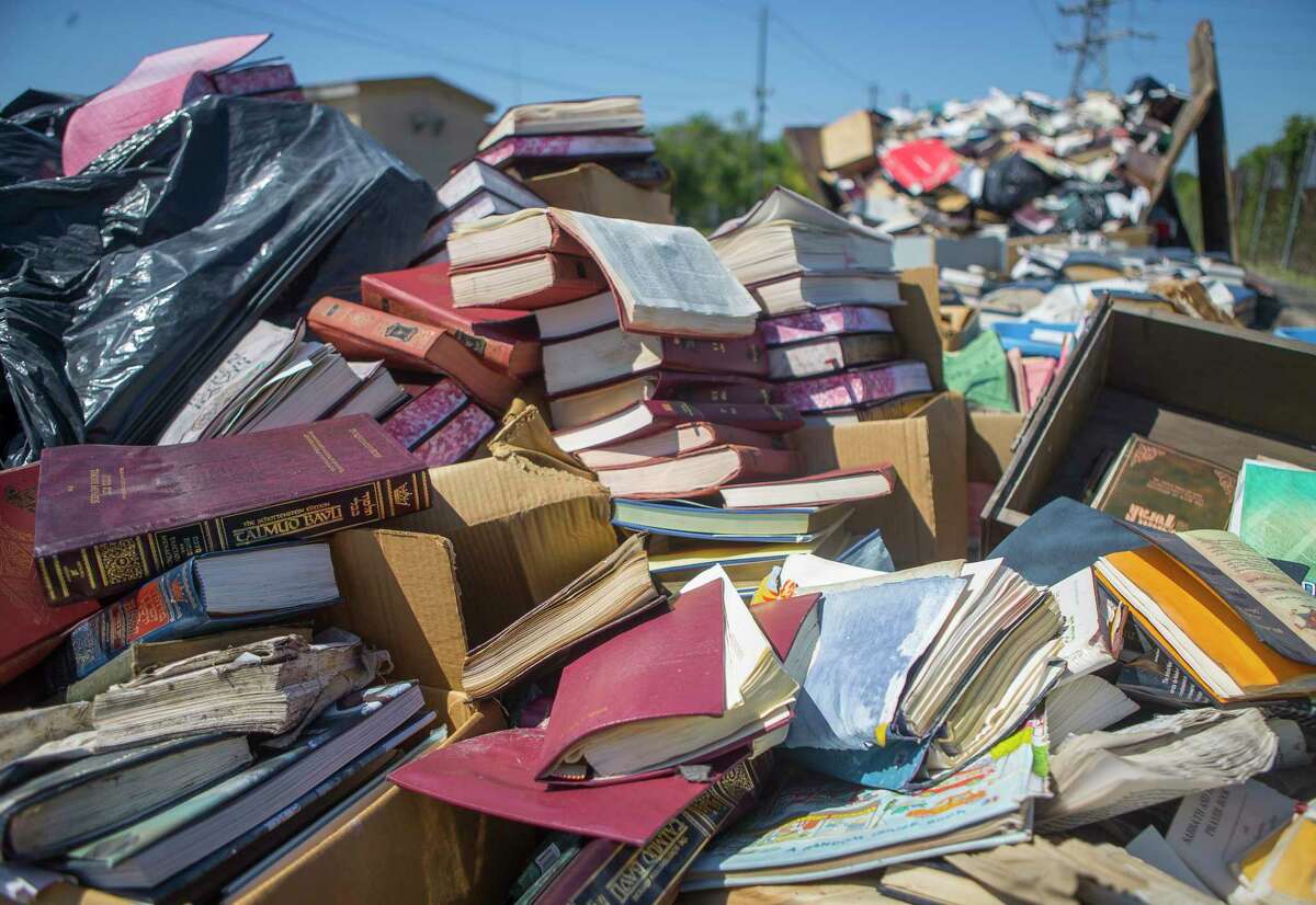 Hundreds of holy books from the United Orthodox Synagogues were removed from the flooded building. ﻿